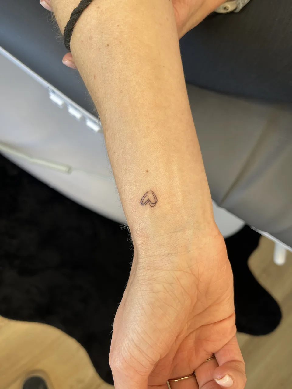 Tiny open heart tattoo on wrist — Olive N Sage Reno NV
